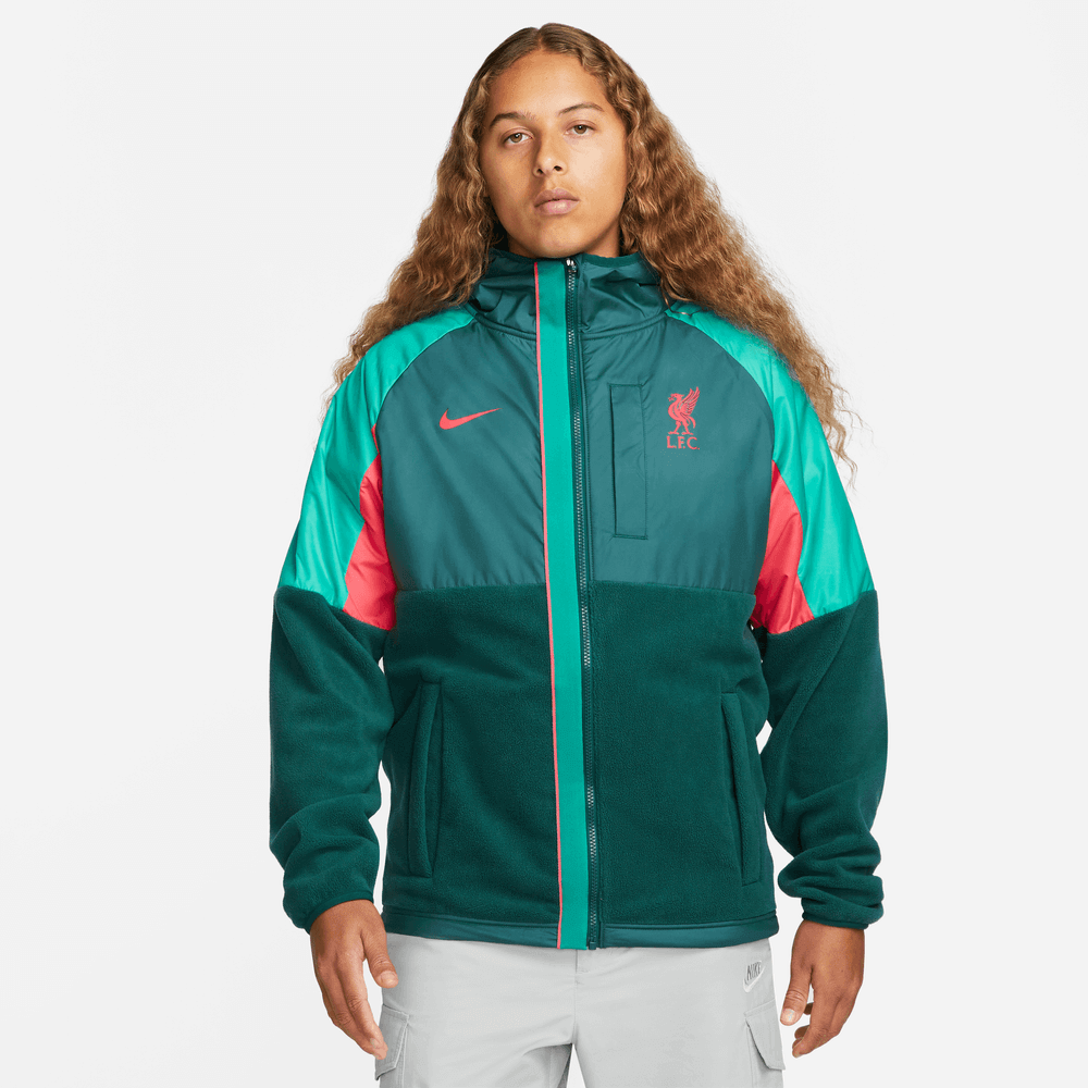 http://www.prosoccer.com/cdn/shop/products/Nike2022-23LiverpoolWinterizedAWFJacket-AtomicTeal-SirenRed_Model-Front.png?v=1671746894