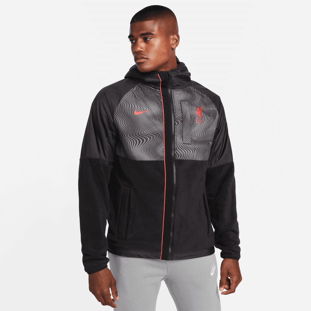 http://www.prosoccer.com/cdn/shop/products/Nike2022-23LiverpoolWinterizedAWFJacket-Black-Red_Model-Front.png?v=1671744737