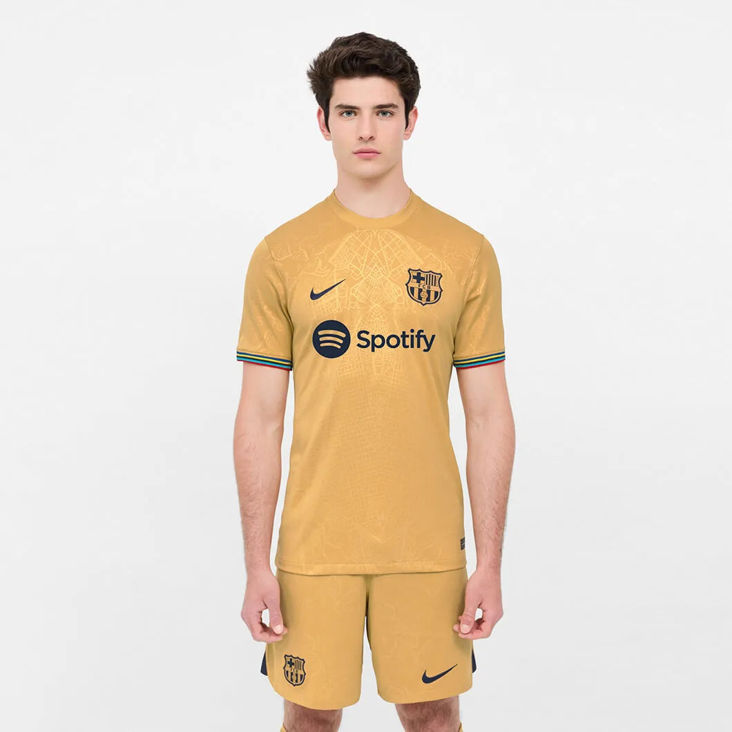 Nike 2022-23 FC Barcelona Away Jersey - Club Gold-Obsidian (Model - Front)