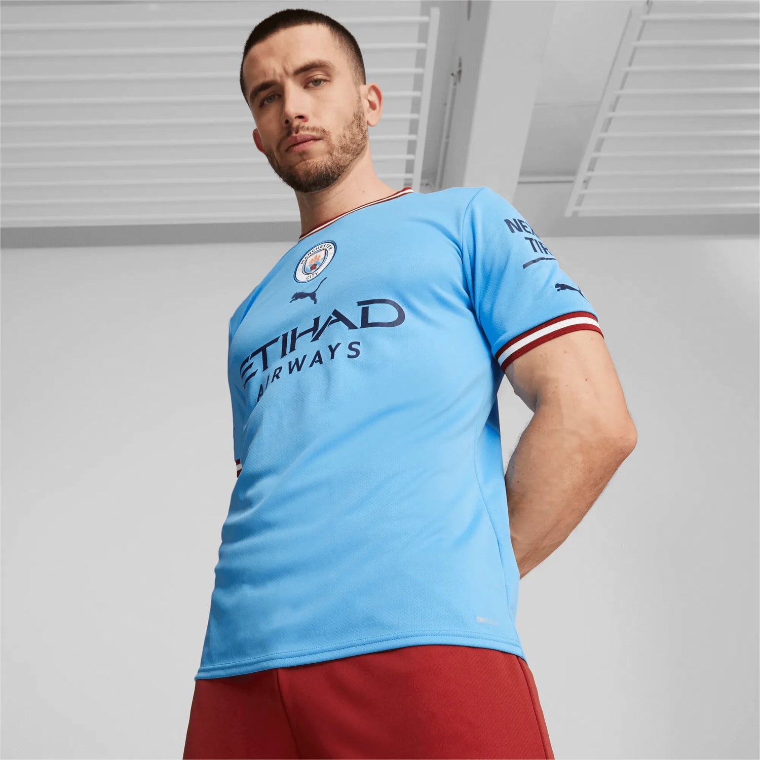 Puma 2022-23 Manchester City Home Jersey - Light Blue-Intense Red (Model - Front)